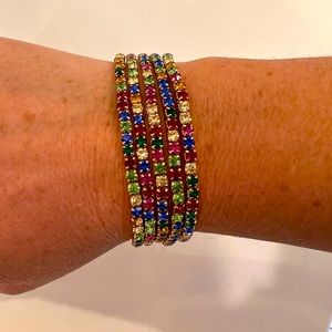 5 Bracelets with Multi colored gems around